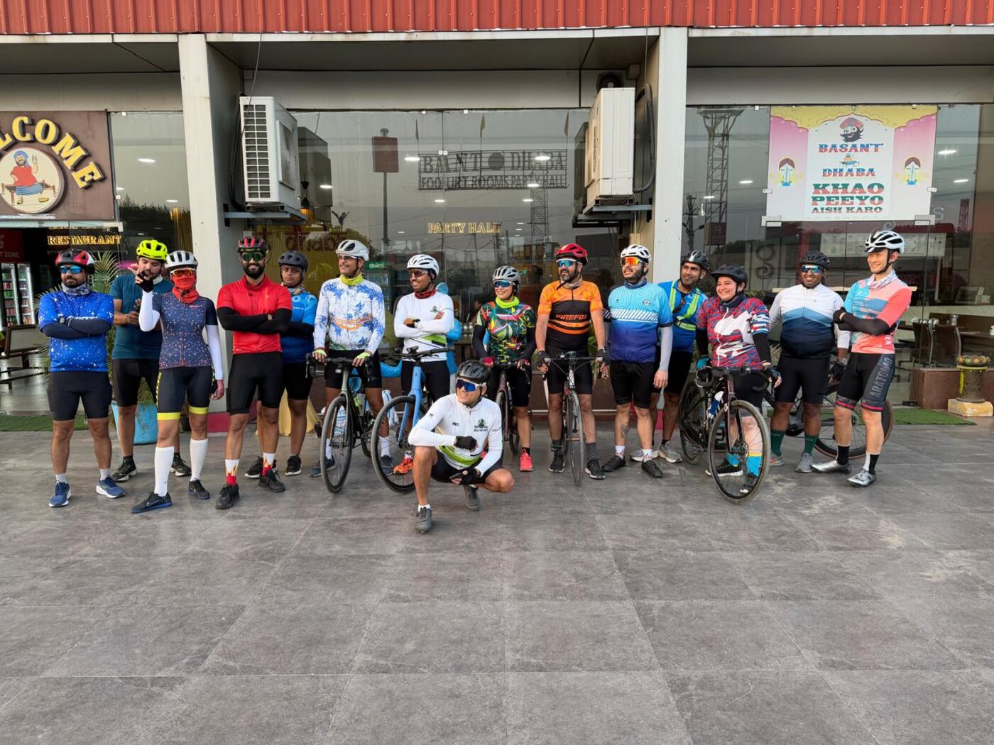 The group lined up with their bikes before sunrise